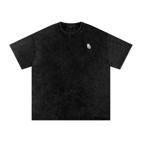 Black t-shirt with a small white logo on a white background