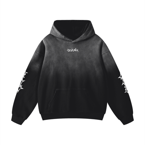 Black hoodie with white designs on sleeves against a white background